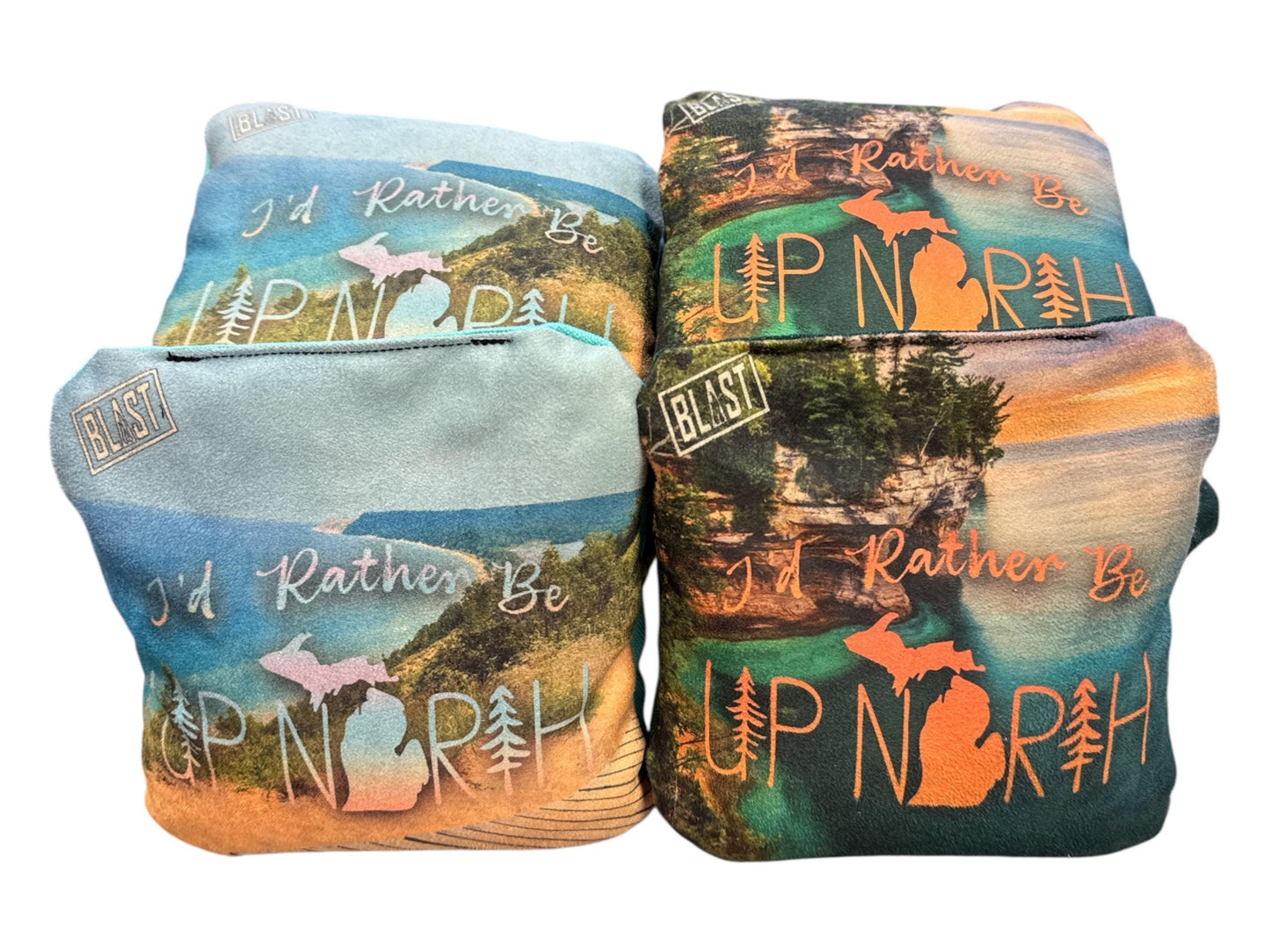 two bags with printed designs featuring the text "I'd Rather Be" and "I'm Rather Be" along with images of Michigan landscapes, such as lakes and forests.