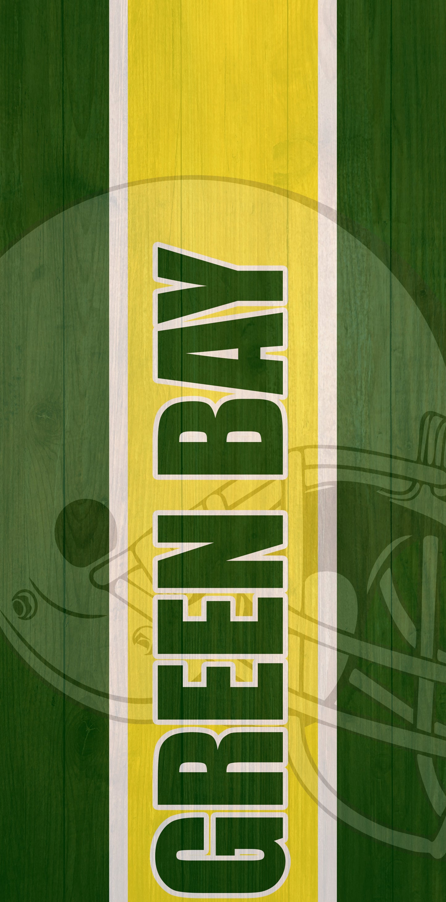 a close up of a green and yellow sign on a wooden surface