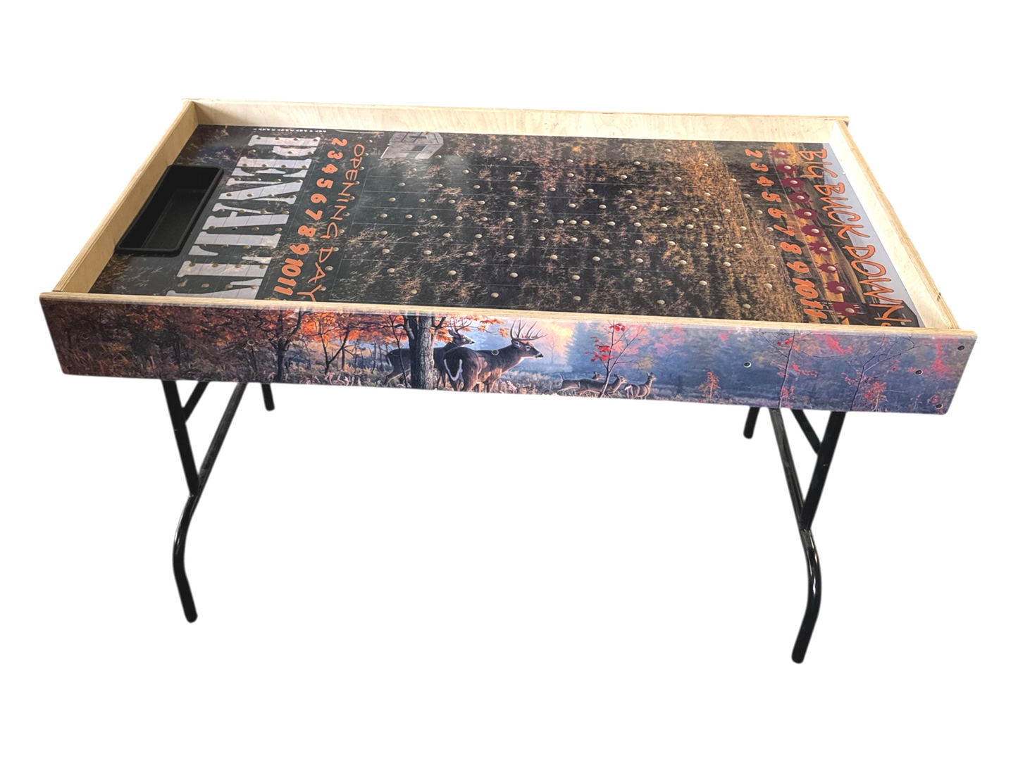 a wooden tray with a decorative design on it, including a deer and a forest scene.
