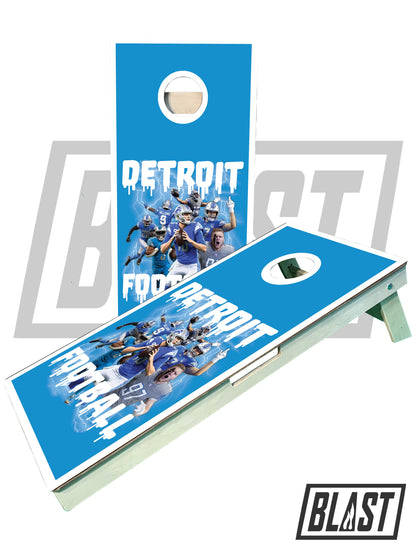 a blue cornhole game with detroit football on it