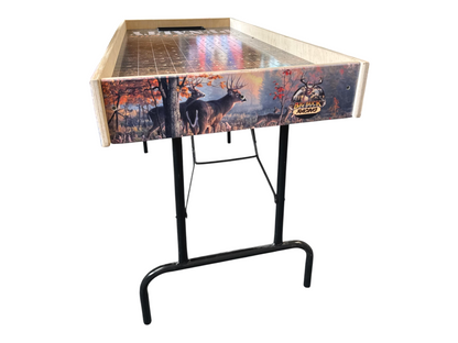 a wooden table with a decorative design on the front, depicting deer in a forest setting.