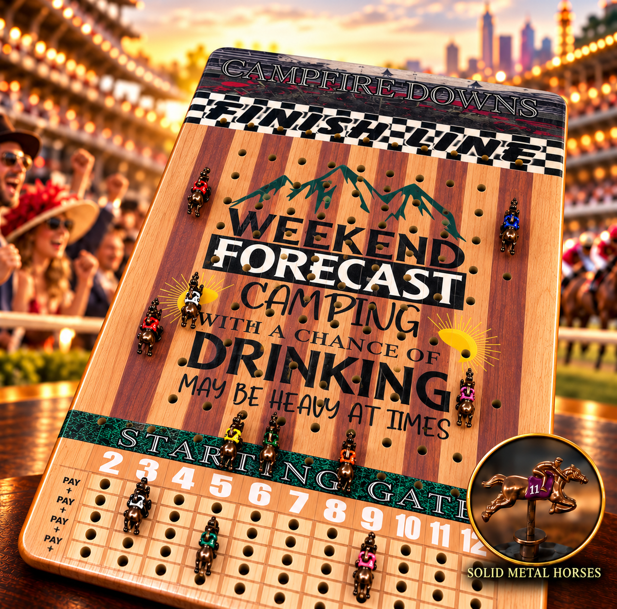 The image is a colorful and detailed advertisement for a game called "Weekend Forecast Camping with a Chance of Drinking May Be Heavy at Times". The game board is placed on a table, surrounded by various small figures representing horses and riders. The background of the image is blurred, but it appears to be a stadium or racetrack setting, suggesting that the game is related to horse racing.