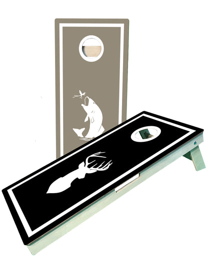 a black and white cornhole board with a picture of a fish on it